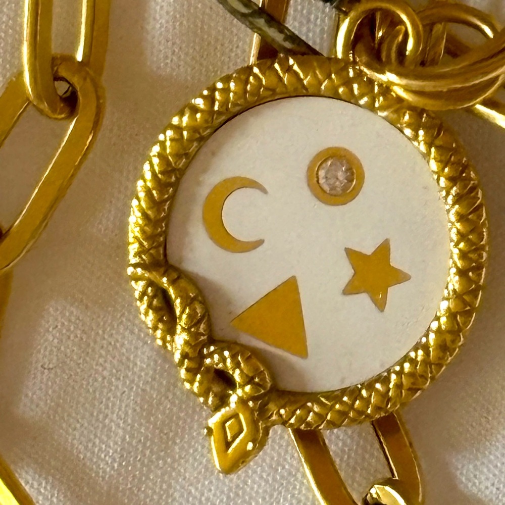 AUTHENTIC FOUNDRAE WHOLENESS MEDALION. 18k YG, diamond, white champleve. Unisex
